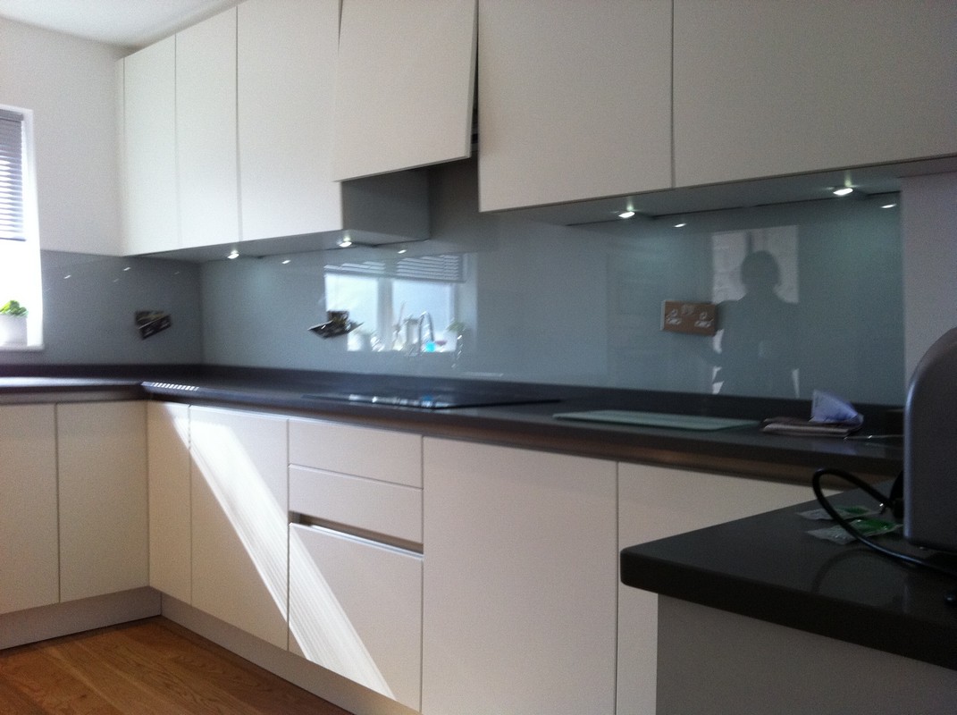 Grey glass kitchen splashback with LED lighting in Hanwell