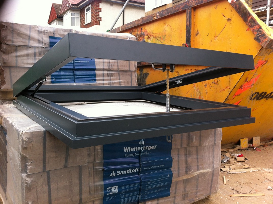 Opening flat roof skylight in anthracite grey installed in Hanwell